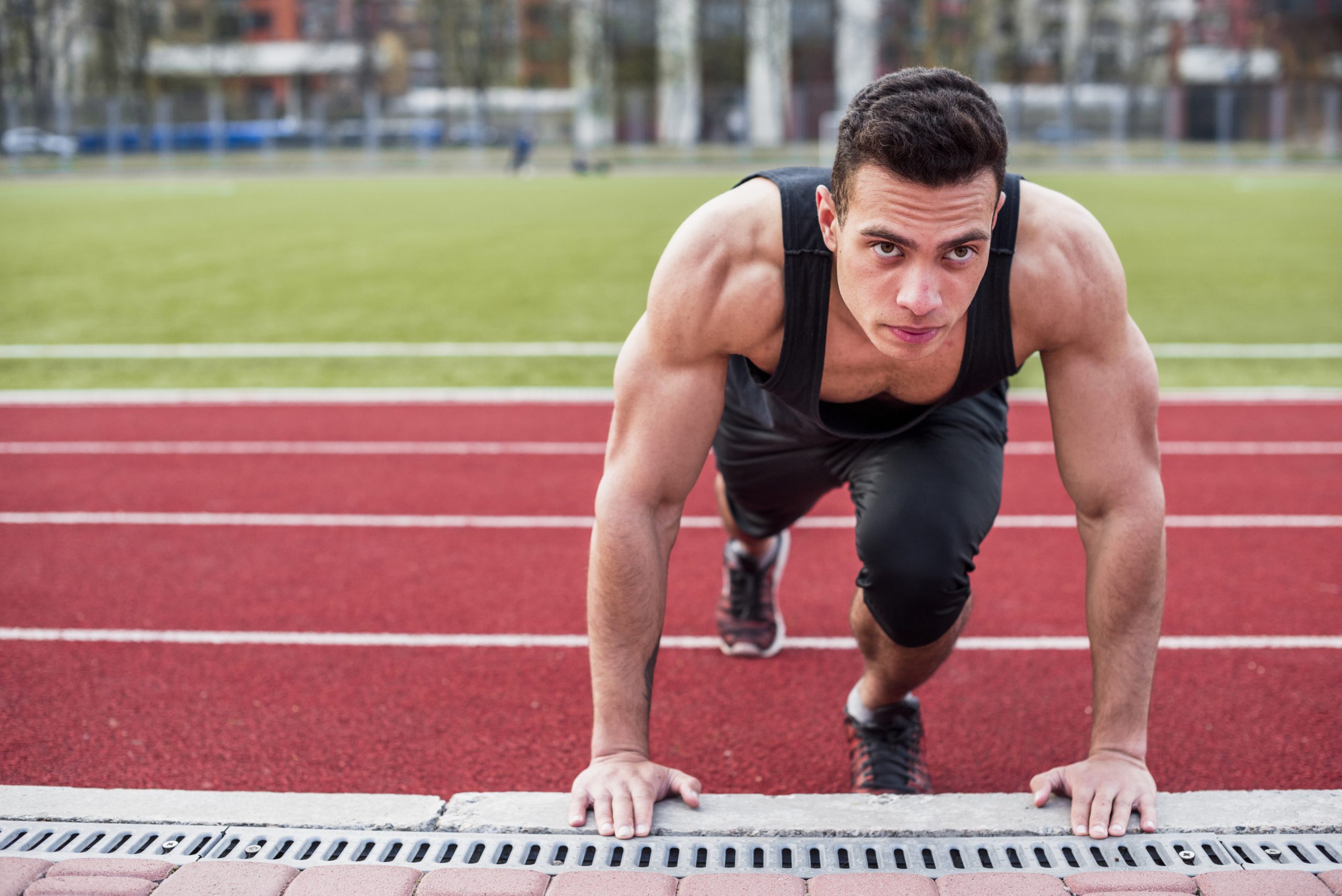 muscular-fit-healthy-young-man-doing-pushup-race-track